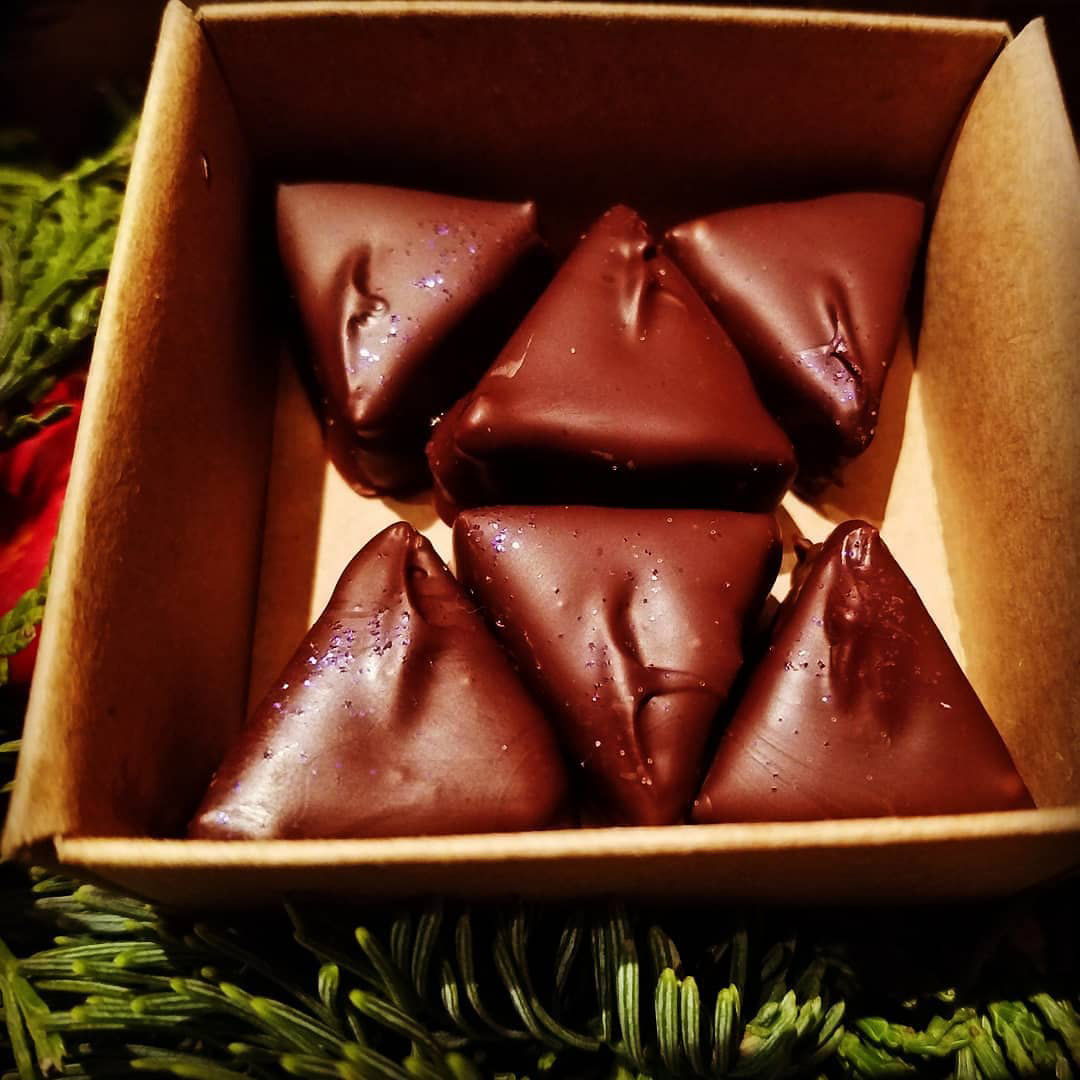 Sarah Bouley Bespoke Chocolate pictured in a box of 6 in triangle shapes